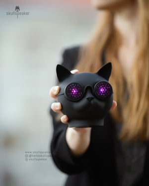 cat bluetooth head speaker in hand with lights from the eyes